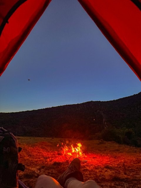 Firelight from a camp at night