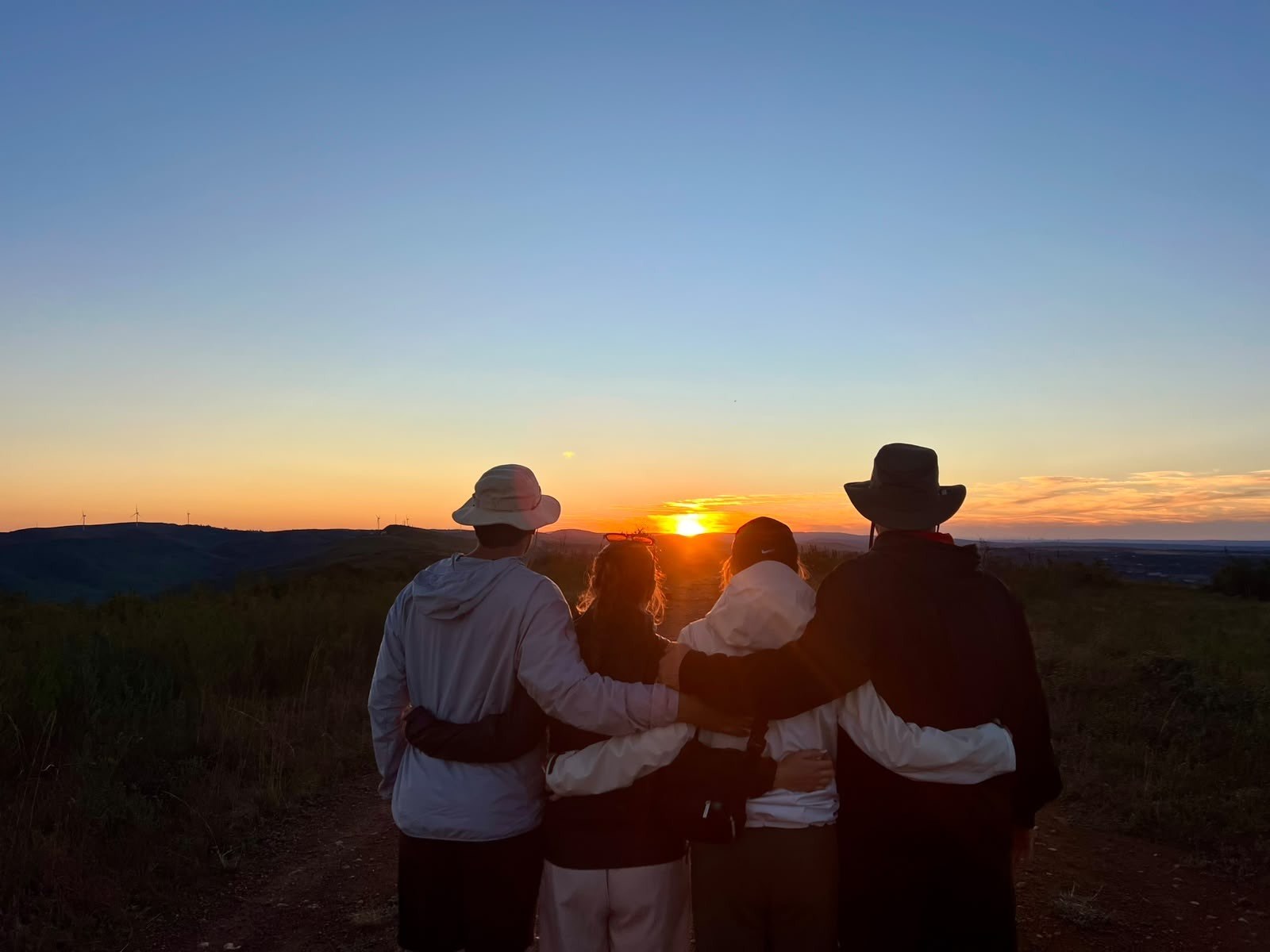 Friends watching the sunset together