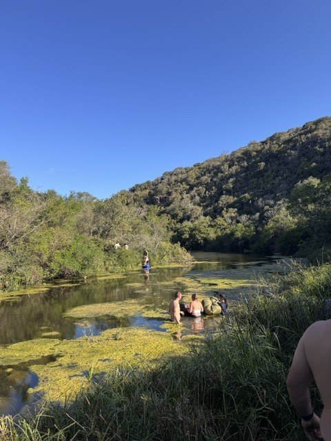 Wild swimming in a river pool